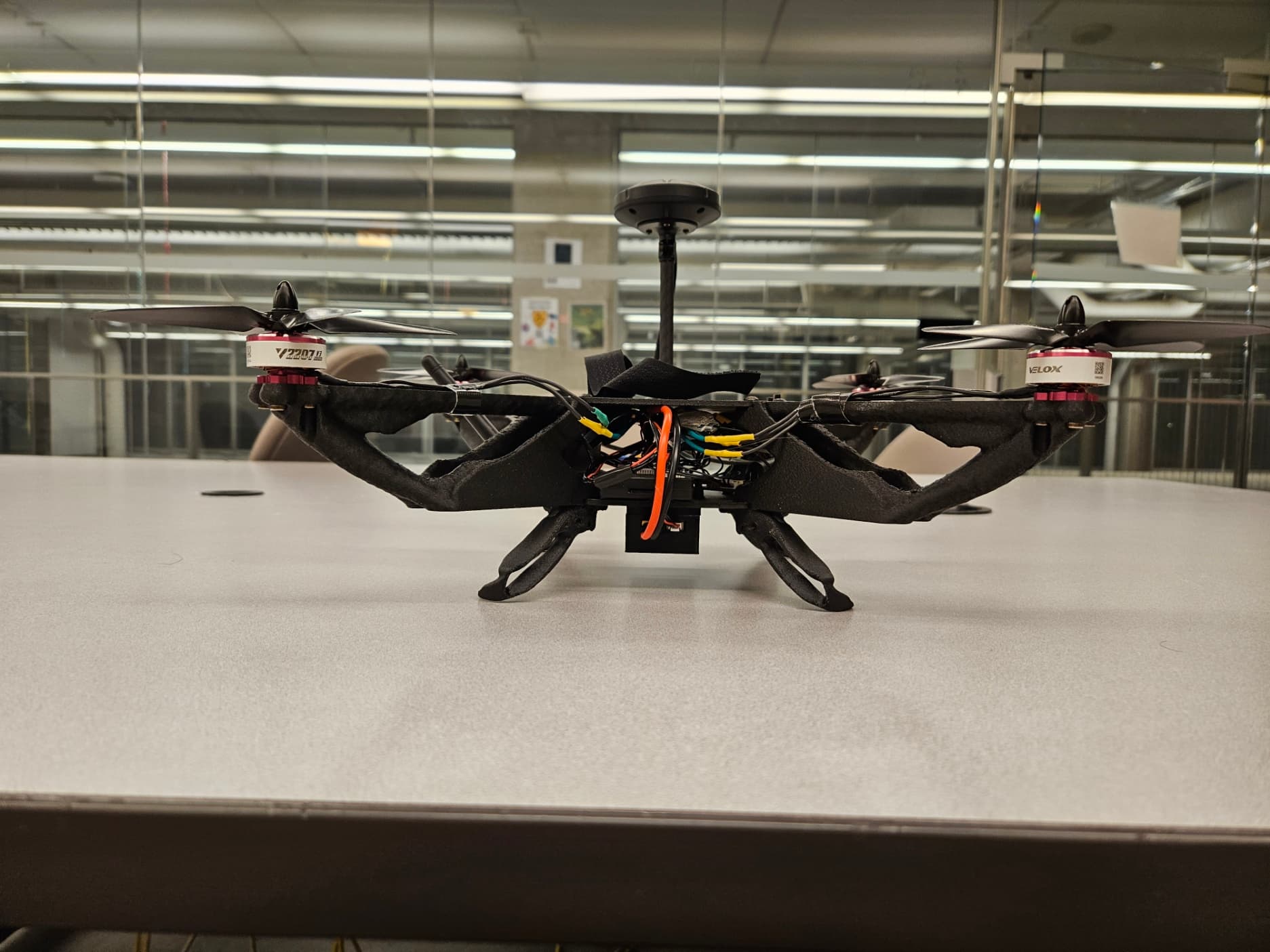 Side profile of drone with onboard electronics and landing system hardware